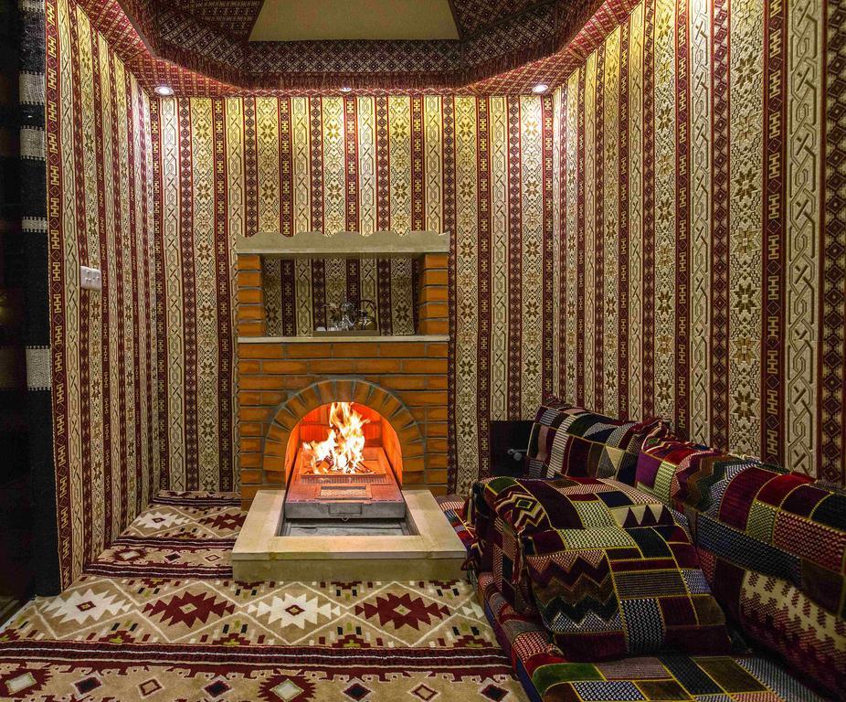 Rest Night Serviced Apartments- Alhamra Эр-Рияд Экстерьер фото A majlis with a fireplace